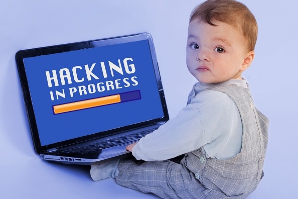 Funny image about the younges hacker in the world - Adorable baby sitting in front of the laptop and hacking.